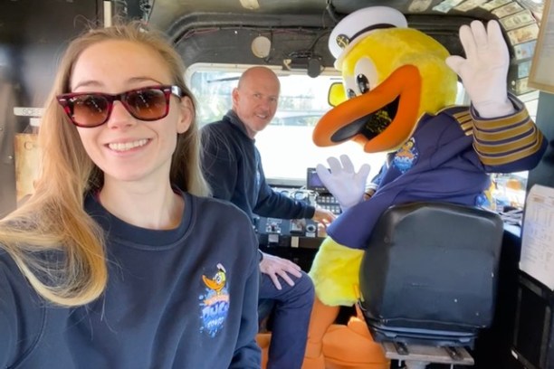 a woman in sunglasses sitting in a car