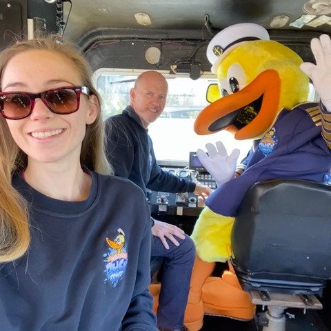 a woman in sunglasses sitting in a car