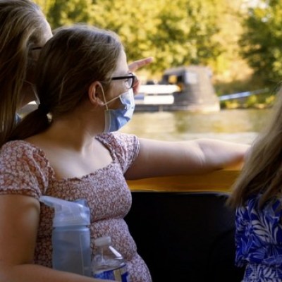 a woman sitting on a table