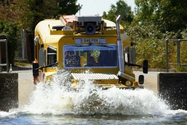 a person driving a bus on a city street