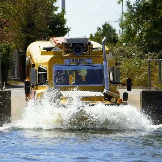 a person driving a bus on a city street