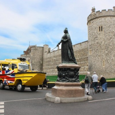 a group of people riding on the back of a truck