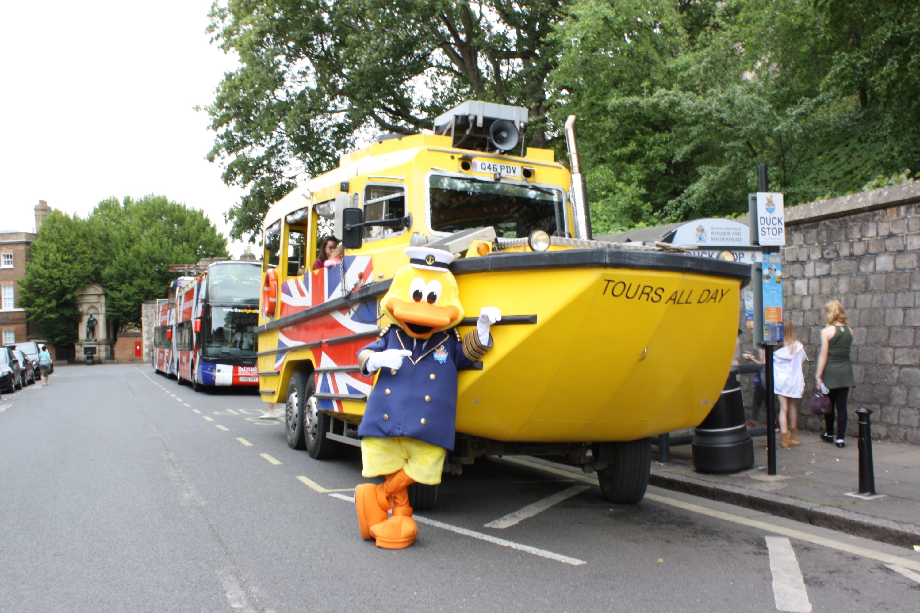 a yellow bus driving down a street