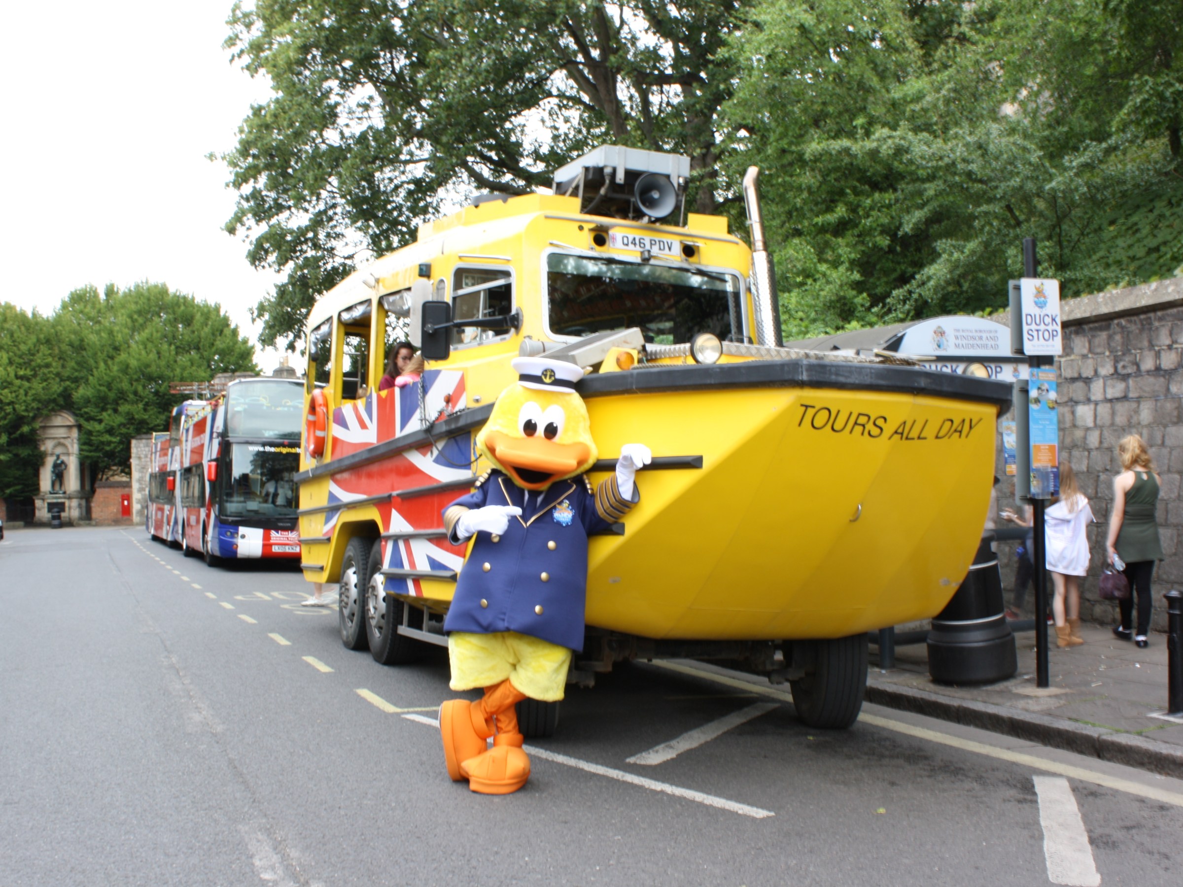 a yellow bus driving down a street