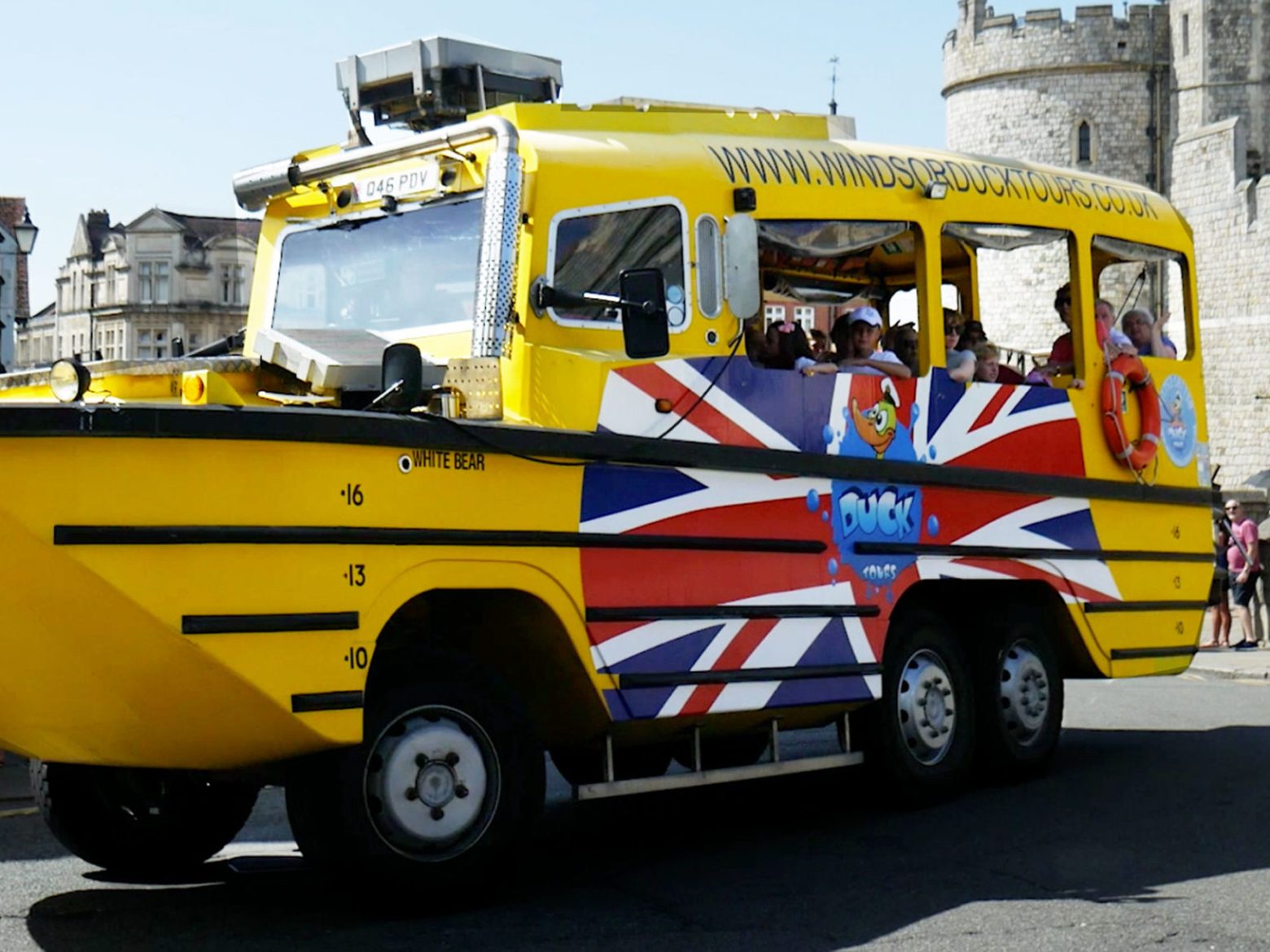 a truck that is driving down the street